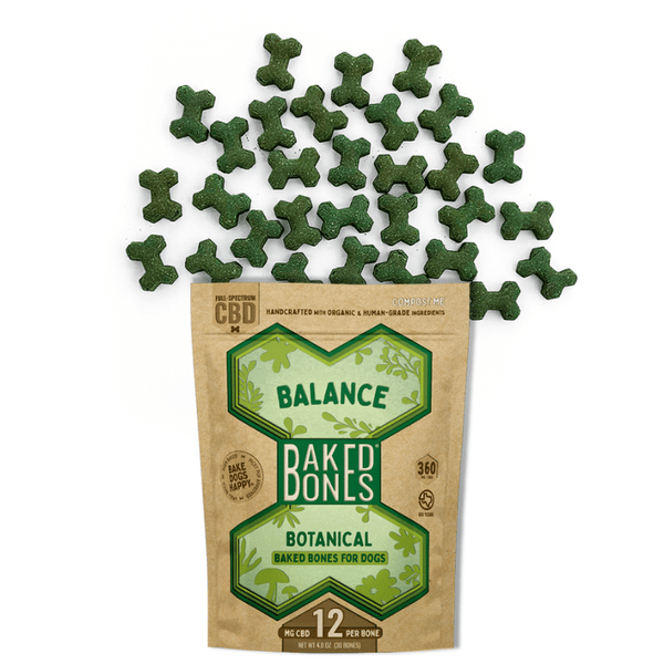Green baked dog bones spilling out of a Kraft BakedBones bag with a green bone and "balance" on the front
